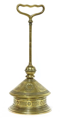 Lot 495 - An Aesthetic Movement brass door porter