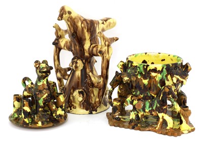 Lot 420 - An 'art populaire' treacle glazed pottery tobacco jar and cover