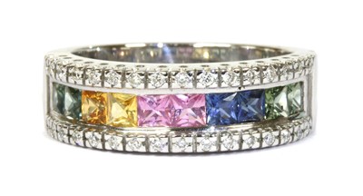 Lot 218 - An 18ct white gold rainbow sapphire and diamond ring