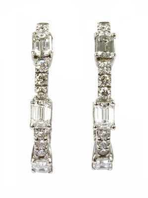 Lot 172 - A pair of white gold diamond hoop earrings