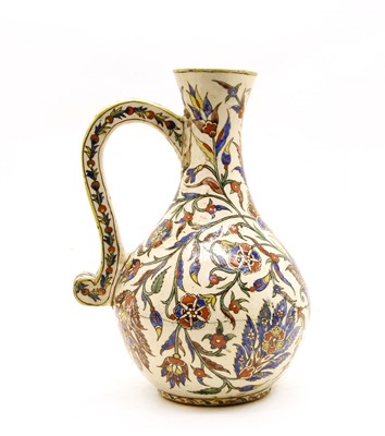 Lot 240 - An Iznik pottery jug