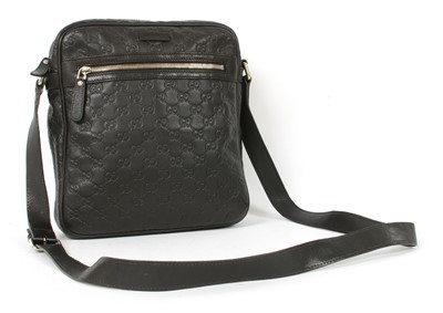 Lot 29 - A Gucci black leather crossbody messenger bag