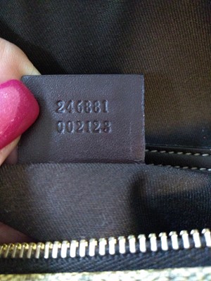 Lot 35 - A Gucci beige coated canvas shoulder bag