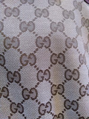 Lot 40 - A Gucci beige monogrammed canvas medium 'Miss' tote