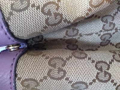 Lot 40 - A Gucci beige monogrammed canvas medium 'Miss' tote