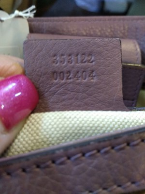 Lot 40 - A Gucci beige monogrammed canvas medium 'Miss' tote