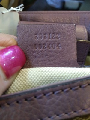 Lot 40 - A Gucci beige monogrammed canvas medium 'Miss' tote
