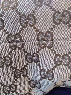 Lot 40 - A Gucci beige monogrammed canvas medium 'Miss' tote
