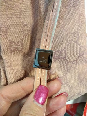 Lot 43 - A Gucci pink monogrammed canvas mini drawstring backpack