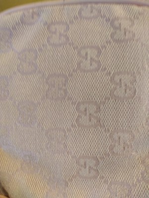 Lot 43 - A Gucci pink monogrammed canvas mini drawstring backpack