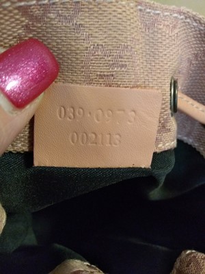 Lot 43 - A Gucci pink monogrammed canvas mini drawstring backpack