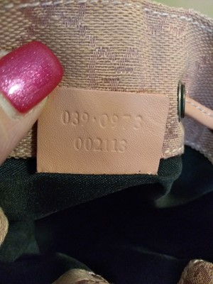 Lot 43 - A Gucci pink monogrammed canvas mini drawstring backpack
