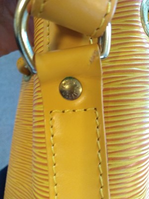 Lot 28 - A Louis Vuitton yellow Epi leather 'Noé' shoulder bag