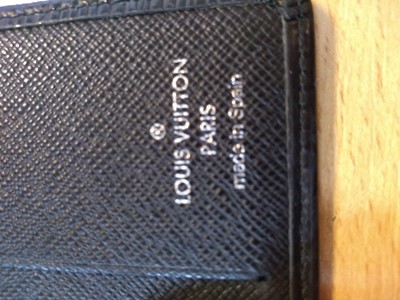 Lot 94 - A Louis Vuitton black Epi leather 'Porte-Billets 6' wallet