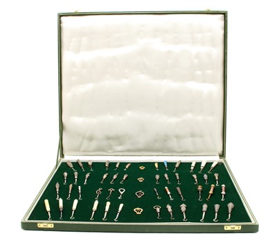 Lot 440 - A cased collection of button hooks with various handles