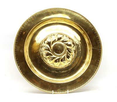 Lot 174 - A Jacobean style brass embossed alms dish