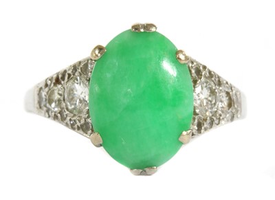 Lot 32 - A white gold jade and diamond ring