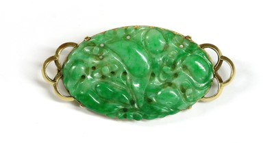 Lot 321 - A Dutch gold mounted pierced nephrite plaque brooch, c.1925