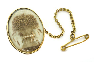 Lot 20 - A Georgian split pearl memorial wheatsheaf glazed panel