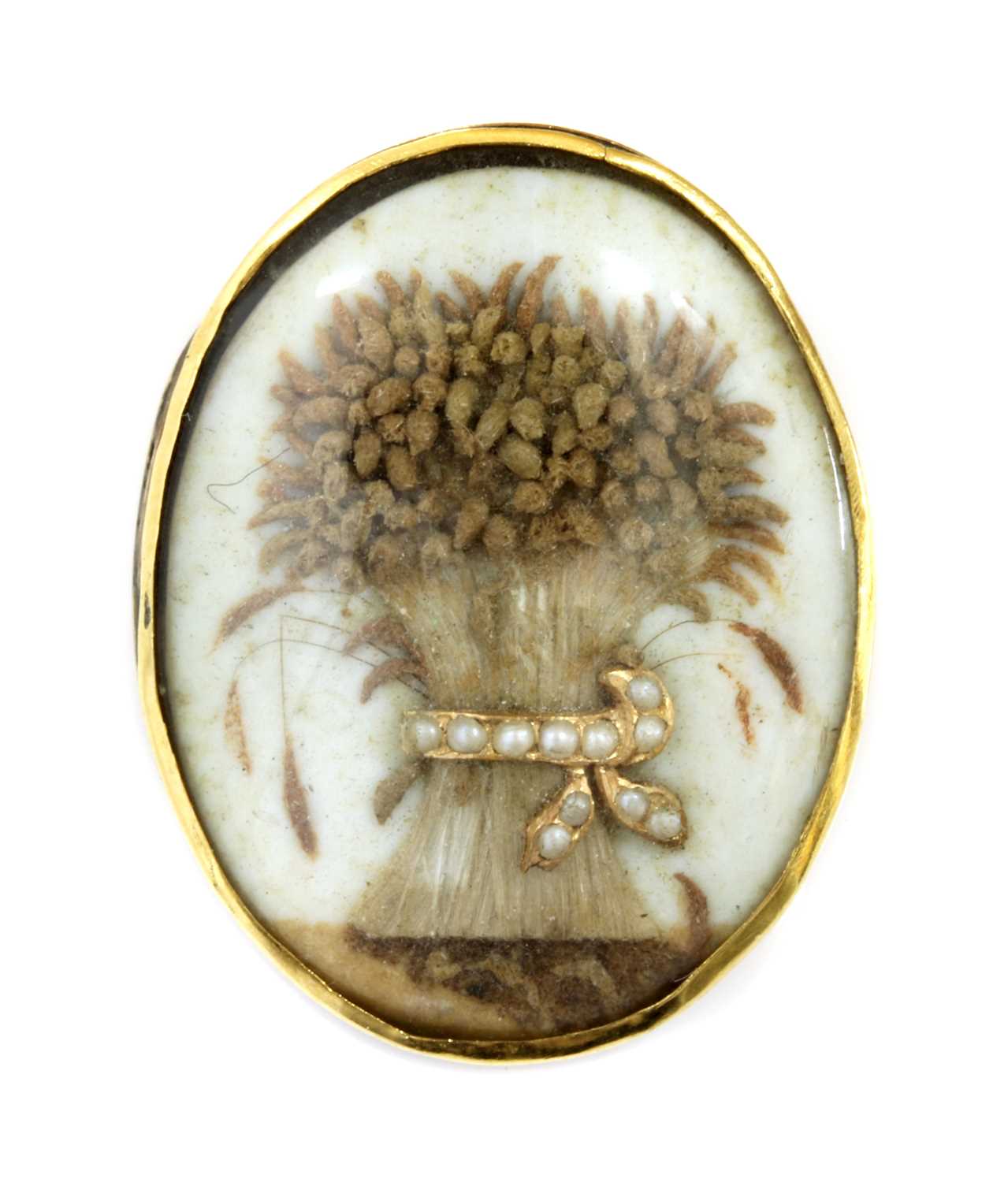 Lot 20 - A Georgian split pearl memorial wheatsheaf glazed panel