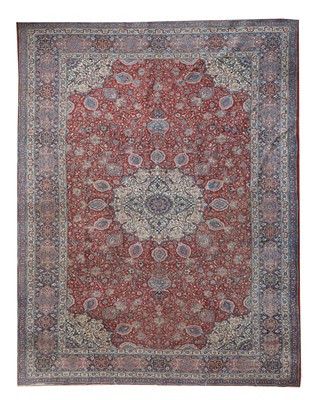 Lot 767 - A large Persian Tabriz carpet