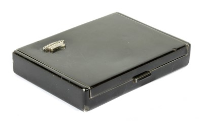 Lot 320 - A French silver diamond set black enamel compact