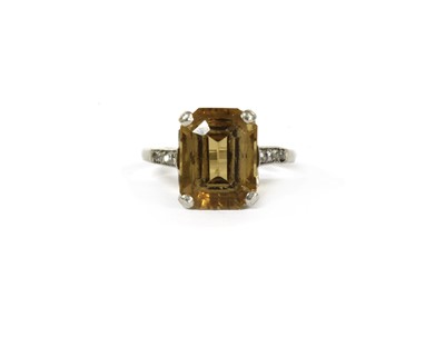 Lot 140 - A platinum citrine and diamond ring