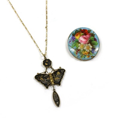 Lot 207 - A gold mounted painted porcelain plaque