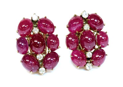 Lot 196 - A pair of cabochon ruby and diamond earrings, c.1945