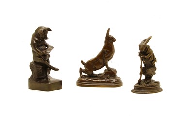 Lot 395C - An anthropomorphic bronze of a pig reading a newspaper