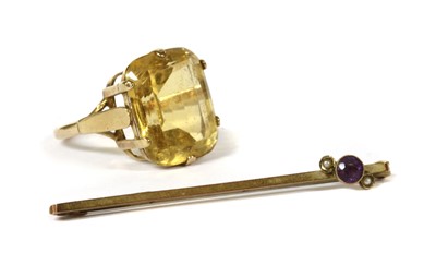 Lot 198 - A gold single stone citrine ring