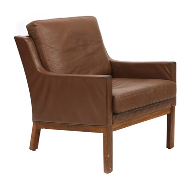 Lot 555 - A Danish rosewood and brown leather armchair