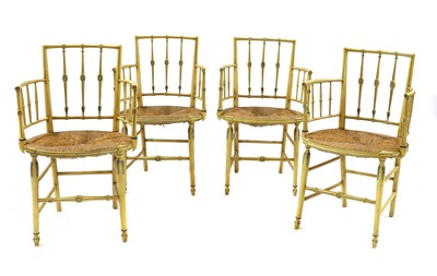 Lot 218 - A set of four painted Regency-style elbow chairs