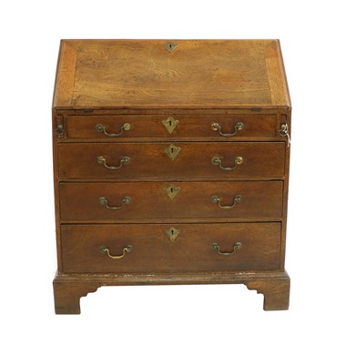 Lot 423 - A George III oak bureau