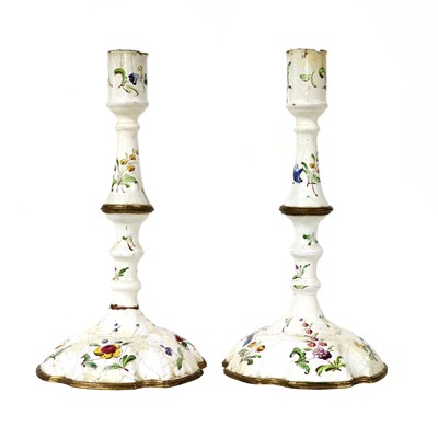 Lot 89 - A pair of Battersea enamel candlesticks