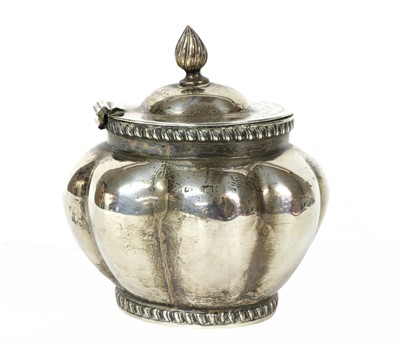 Lot 24 - An oval, lobed, silver tea caddy