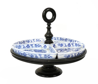 Lot 280 - An ebonised lazy Susan