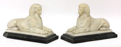 Lot 860 - A pair of carved marble sphinx