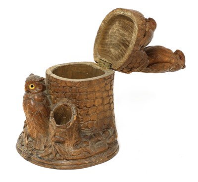 Lot 61 - A Black Forest carved softwood tobacco box and cover