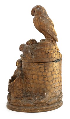Lot 61 - A Black Forest carved softwood tobacco box and cover
