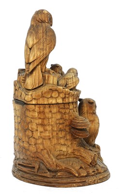 Lot 61 - A Black Forest carved softwood tobacco box and cover