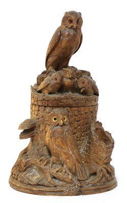 Lot 61 - A Black Forest carved softwood tobacco box and cover