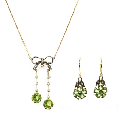 Lot 153 - A gold and silver, peridot split pearl and diamond négligée pendant