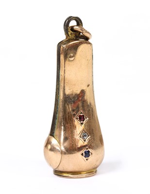 Lot 245 - A gold cased gem set cigar cutter