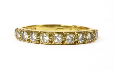 Lot 127 - An 18ct gold diamond half eternity ring