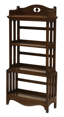 Lot 33 - An Arts and Crafts oak four-tier open bookcase