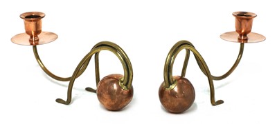 Lot 38 - A pair of Arts and Crafts copper and brass candlesticks
