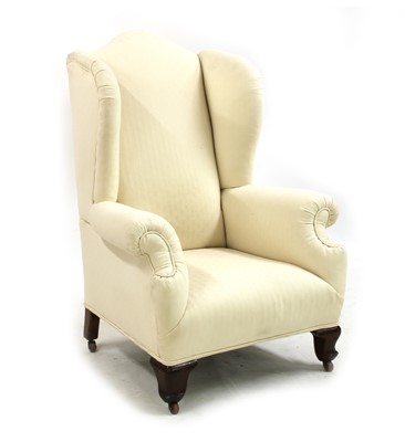 Lot 367 - A wingback armchair