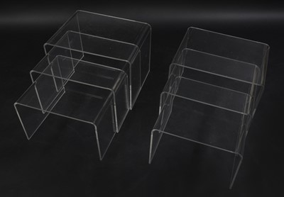 Lot 535 - Two clear Lucite nests of three tables