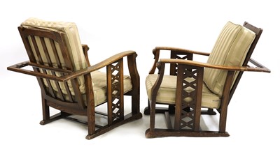 Lot 114 - A pair of Art Deco oak reclining armchairs